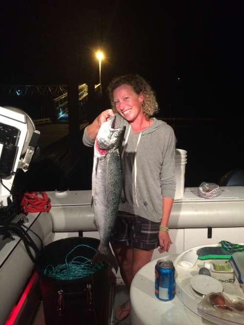 Her first salmon — all smiles with a great catch