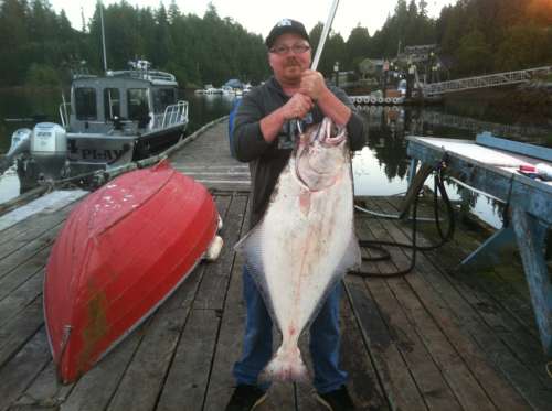 Happy customer showing off a great catch in Bamfield
