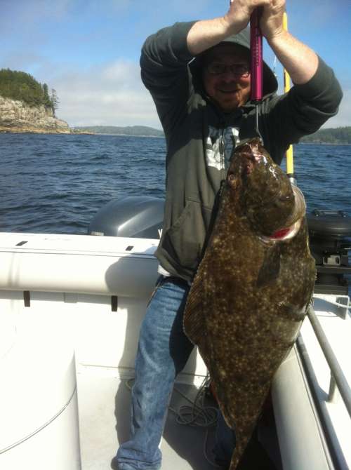 Impressive 40-pound halibut landed on a fishing charter