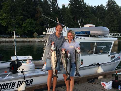 Happy ladies enjoying a fun day of fishing