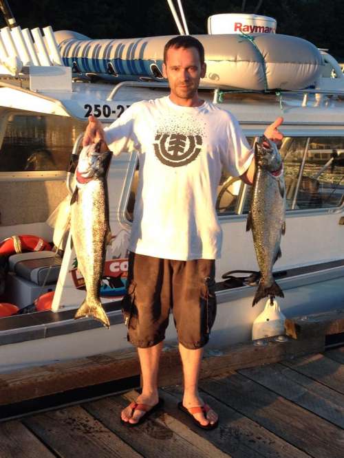 Captain Pat at the helm with a big smile