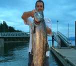 Proud angler with a beautiful 25-pound chinook salmon
